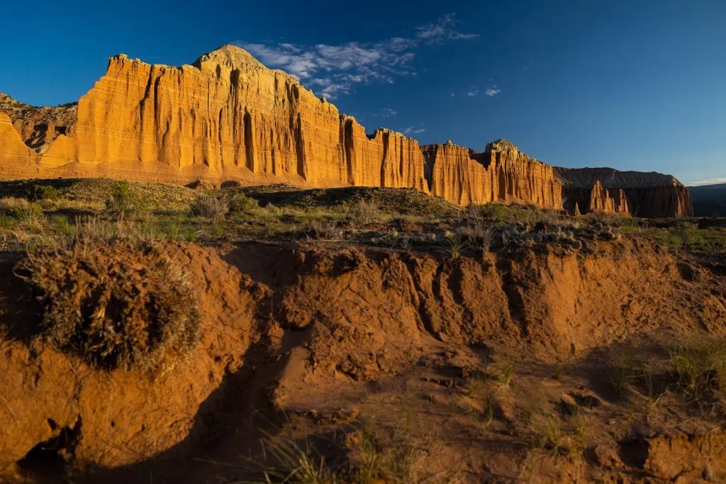 The setting sun casts a gold light on Cathedral Valley in Capitol Reef National Park by Utah photographer Lucy Schultz.