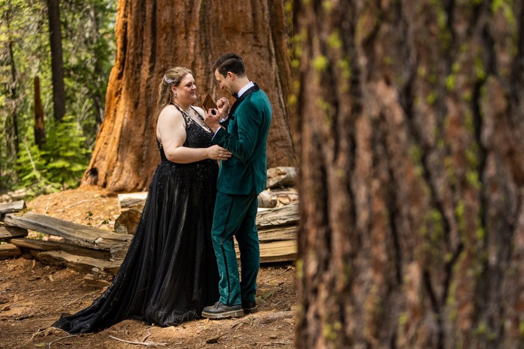 The couple rejoices in just married bliss under the giant sequoias they chose for their elopement ceremony.