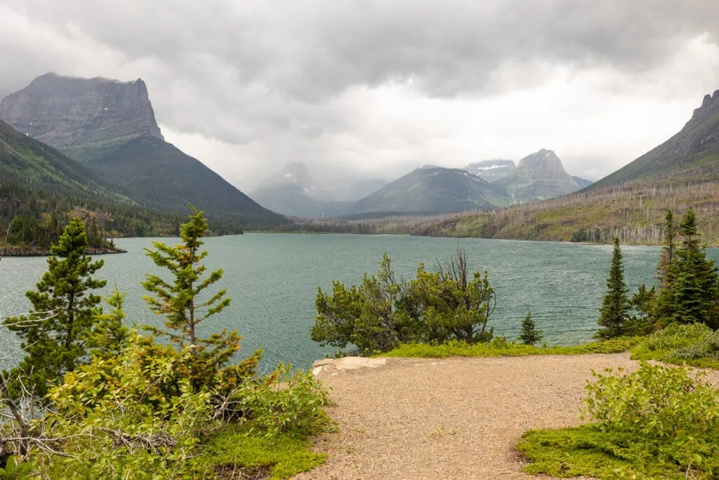 The Sun point elopement ceremony location in Glacier National Park is a photographer's favorite for its big east facing mountain views.