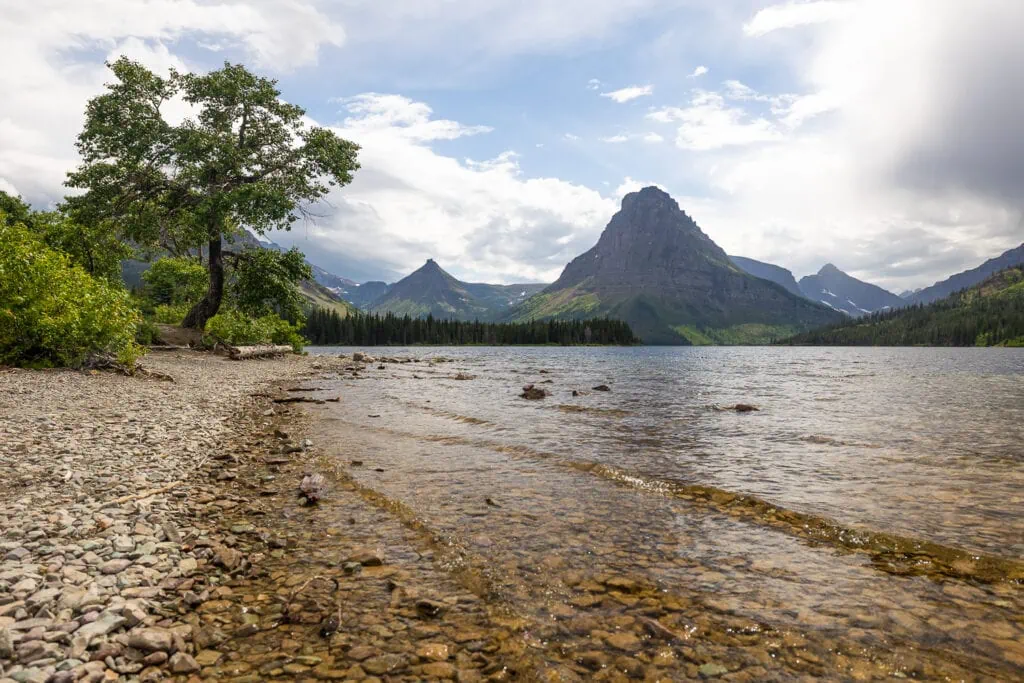 The shore of Two Medicine lake in Glacier National Park makes a beautiful ceremony location for elopements and photographers.