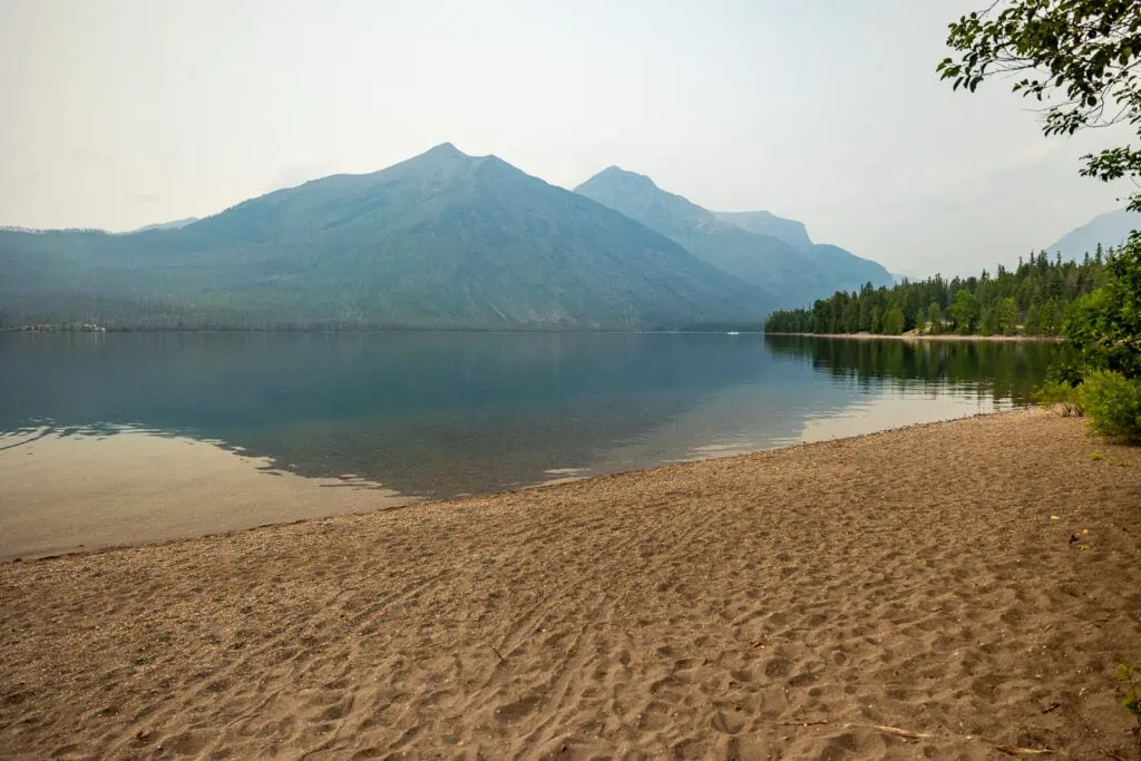 Sprague Beach is one of the elopement locations in Glacier National Park on the shore of Lake McDonald. This sandy beach is private and has big mountain views.