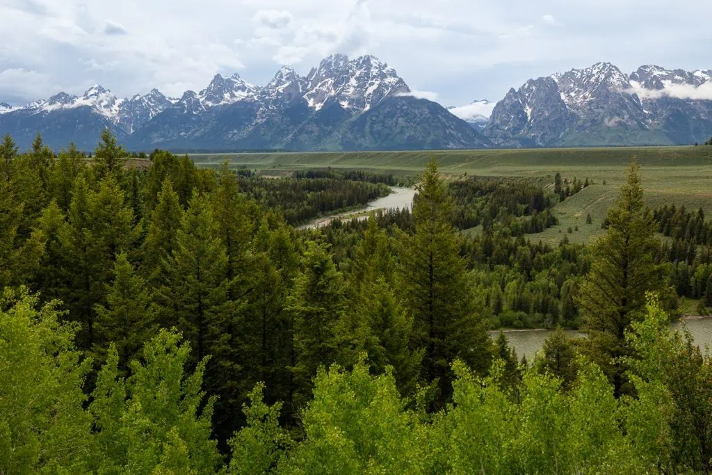 A landscape photo of the Snake River overlook in Grand Tetons national park. It is one of 7 sites in the park that is available to rent for a wedding or elopement ceremony.