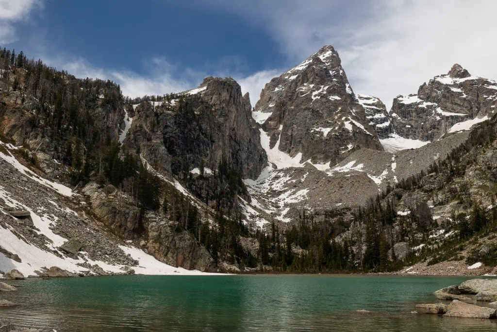 The towering peak over the turquoise blue waters of Delta Lake located in Grand Teton National Park in Wyoming.