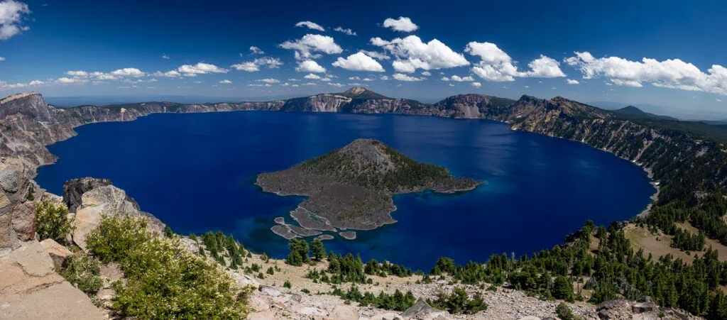 A panoramic image of the sparkling blue Crater Lake National Park.
