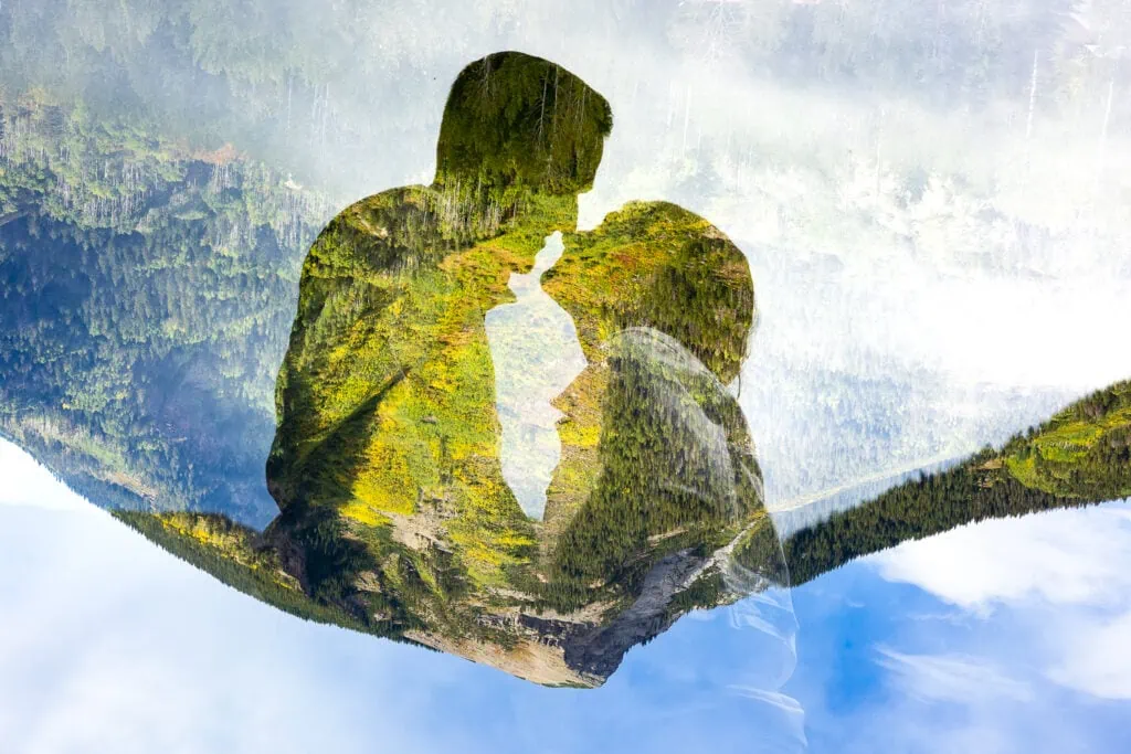 A double exposure elopement photo of a couple's silhouette across a mountain in Marble, Colorado.