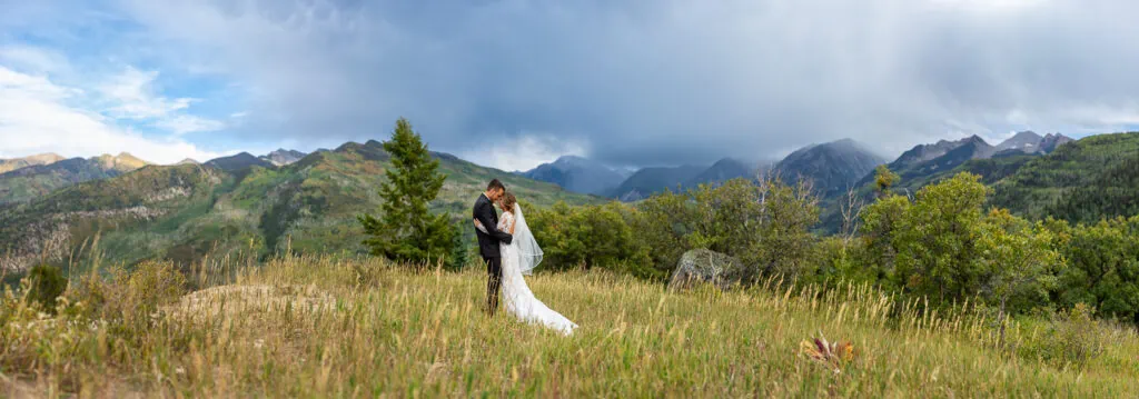 Mcclure pass is the background of this marble colorado elopement photo.