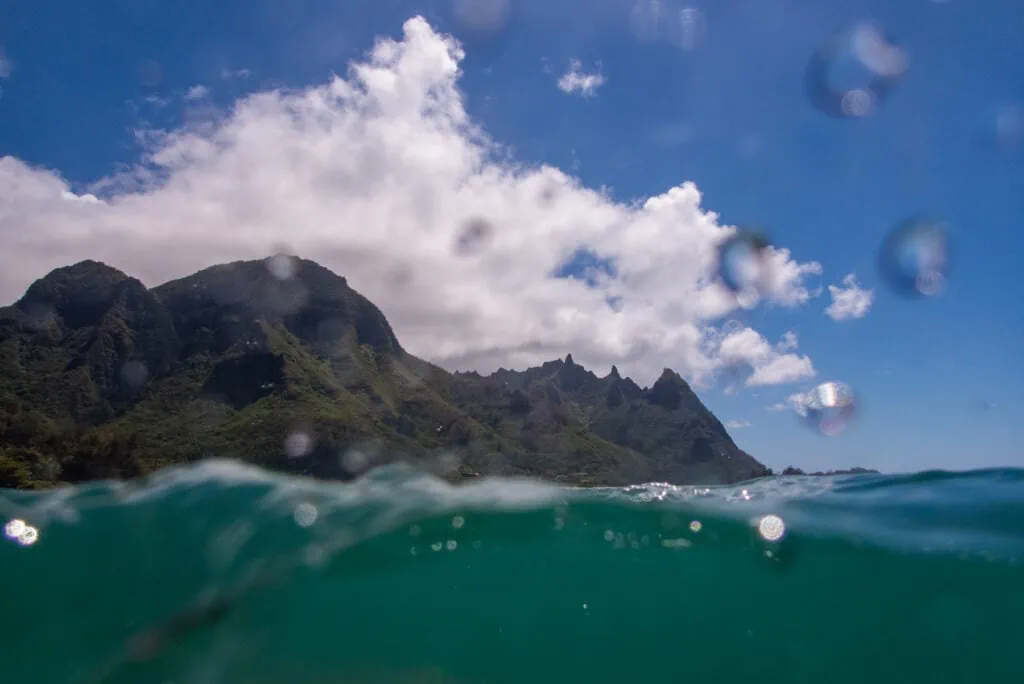 A split perspective photograph of Kauai by underwater diving photographer Lucy Schultz.